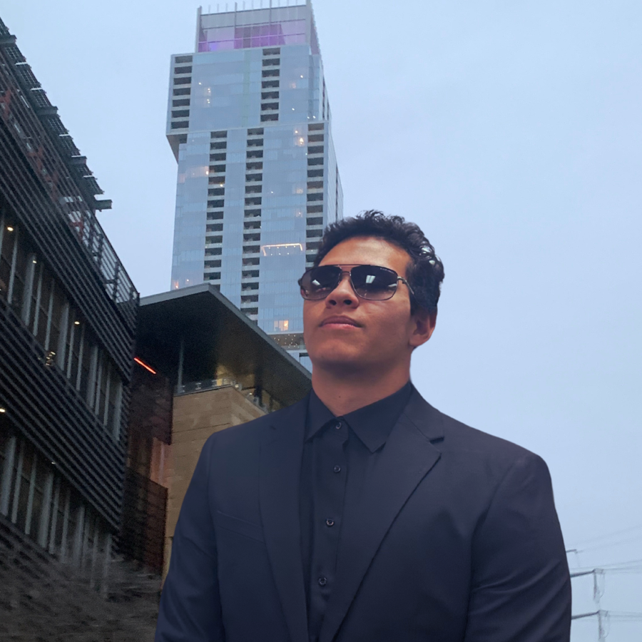 Sitani Mafi in a dark suit in the city